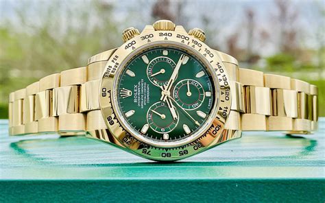 gold Rolex with green dial